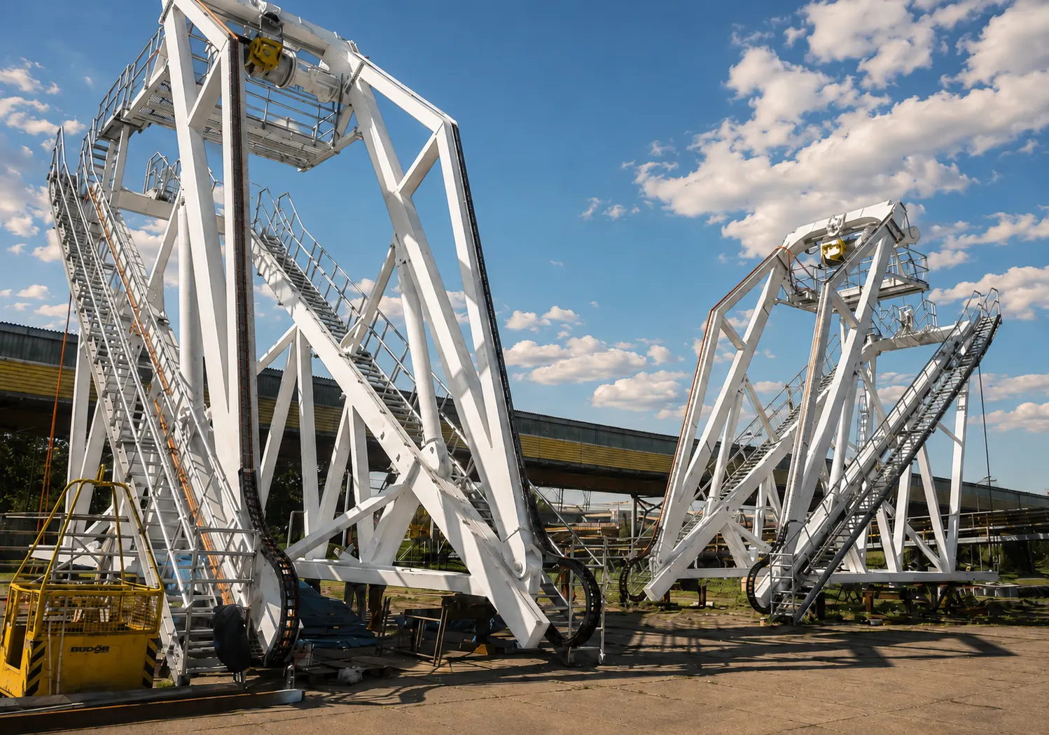 Two davit structures with access stairs at the fabrication yard